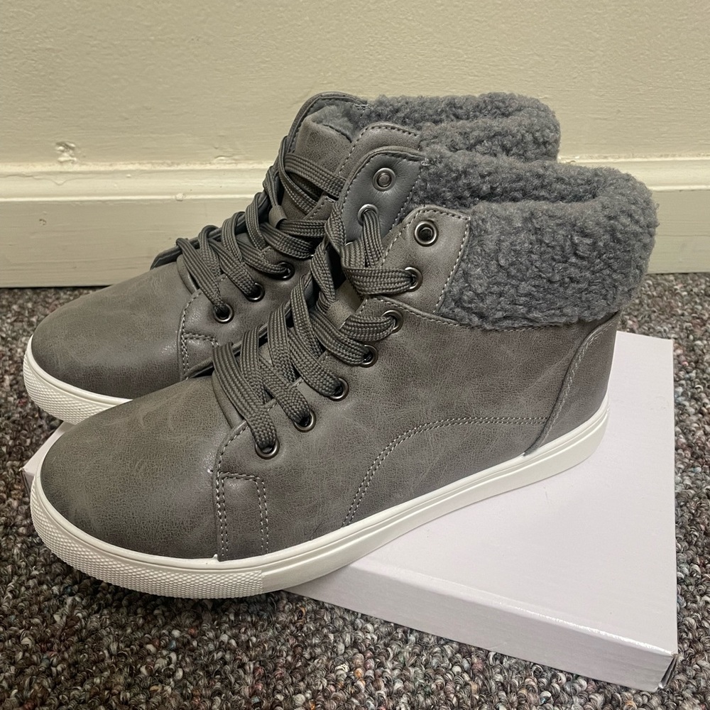 Brand new never worn grey ankle boots with fur.